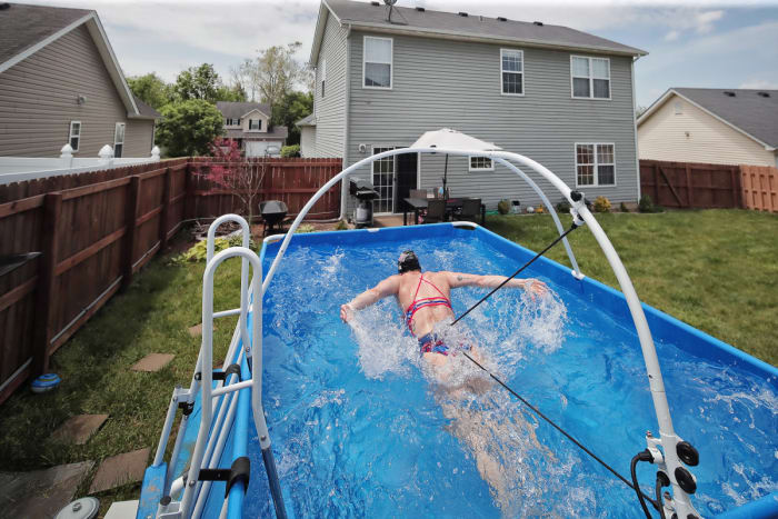 Dahlia's work-around: a backyard iPool, rigged with restraints.